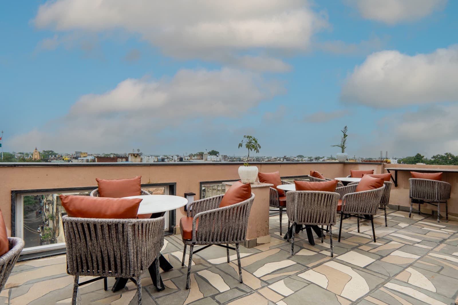 Rooftop terrace seating with city skyline
