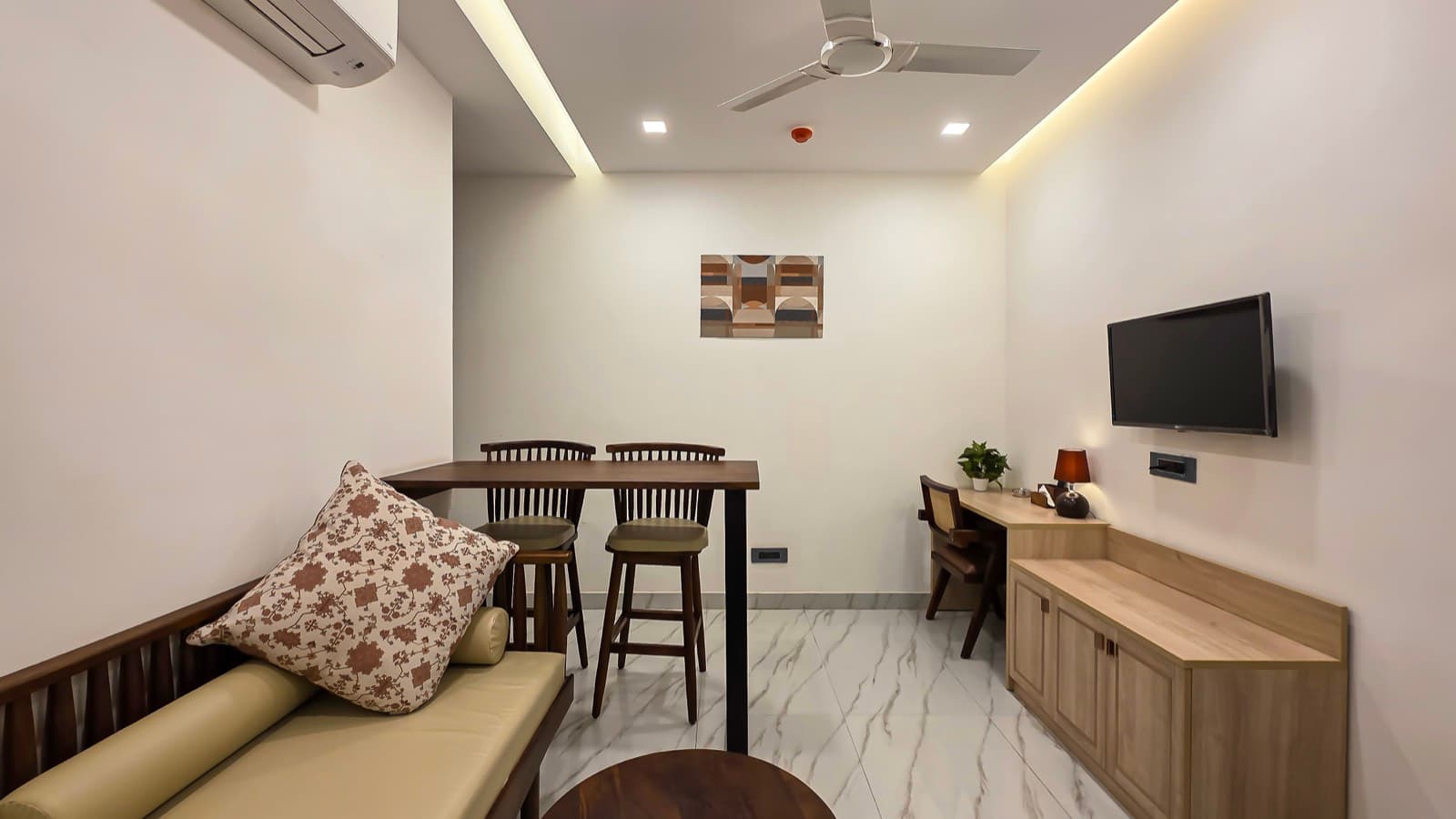 Living area with desk and armchair